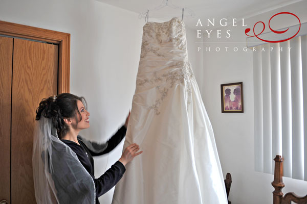 Bride looking at wedding dress