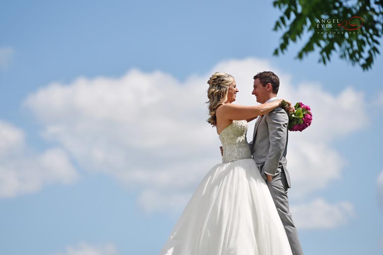 bride-and-groom-with-blue-sky-and-clouds